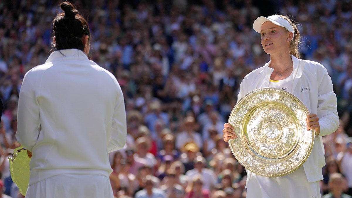 Elena Rybakina celebrates Wimbledon