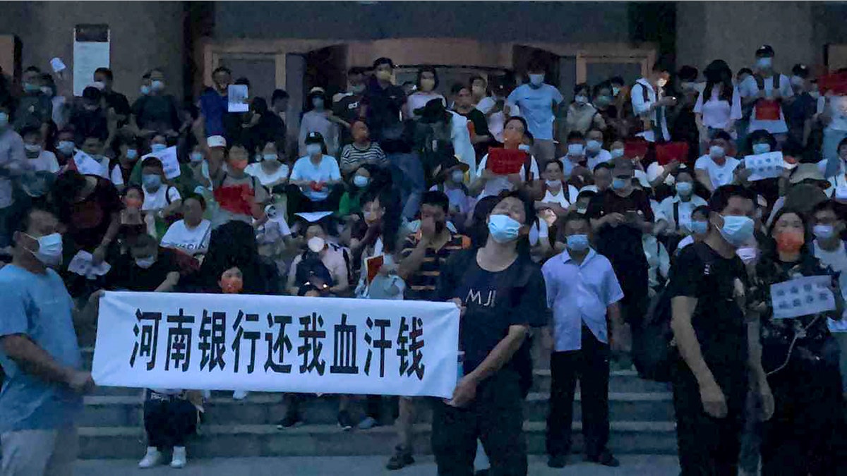 A large crowd of angry Chinese bank depositors