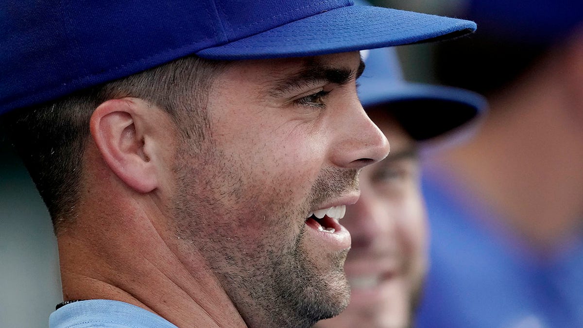 Whit Merrifield watches from the dugout