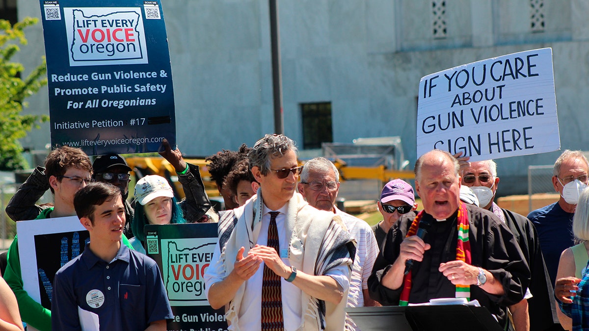 Oregon gun control advocates and Rev. Mark Knutson
