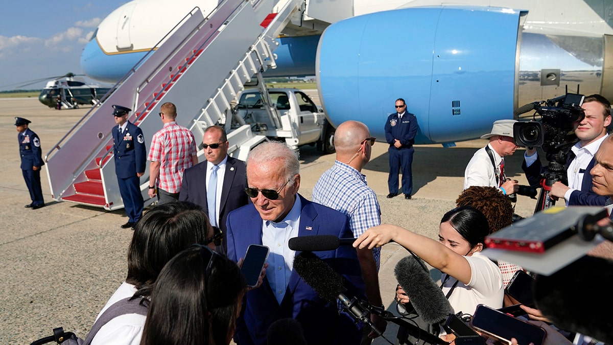 Biden talks to reporters by Air Force 1