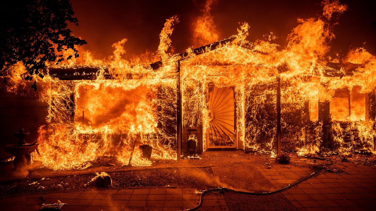 Flames consume a home