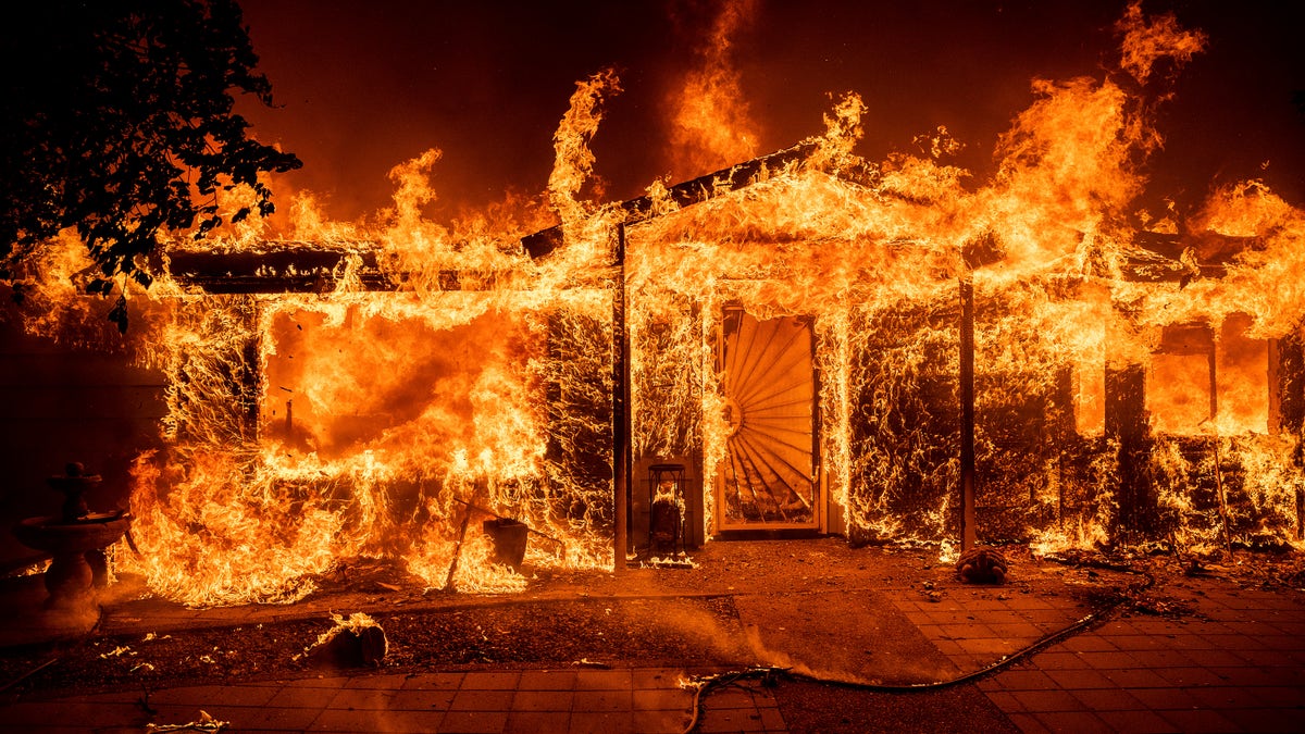 Flames consume a home