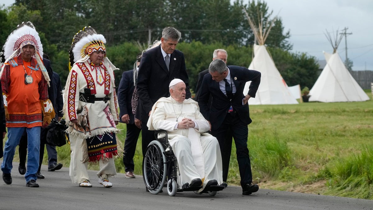 The pope in a wheelchair