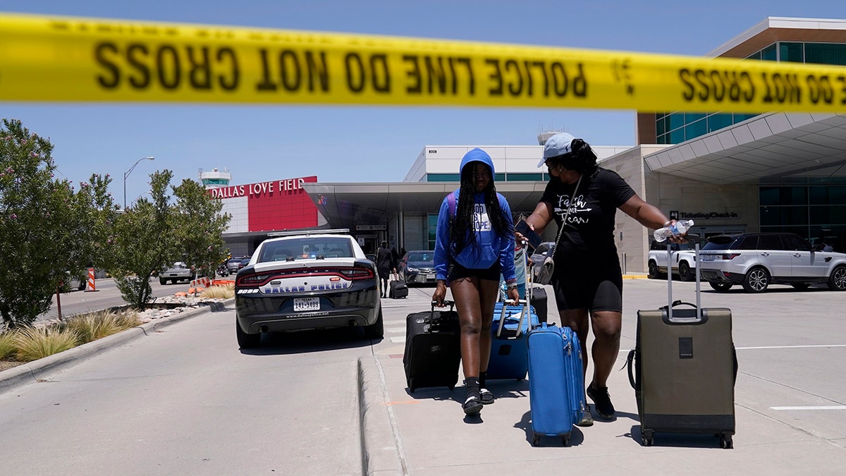 Airport travelers leave Dallas Love Field