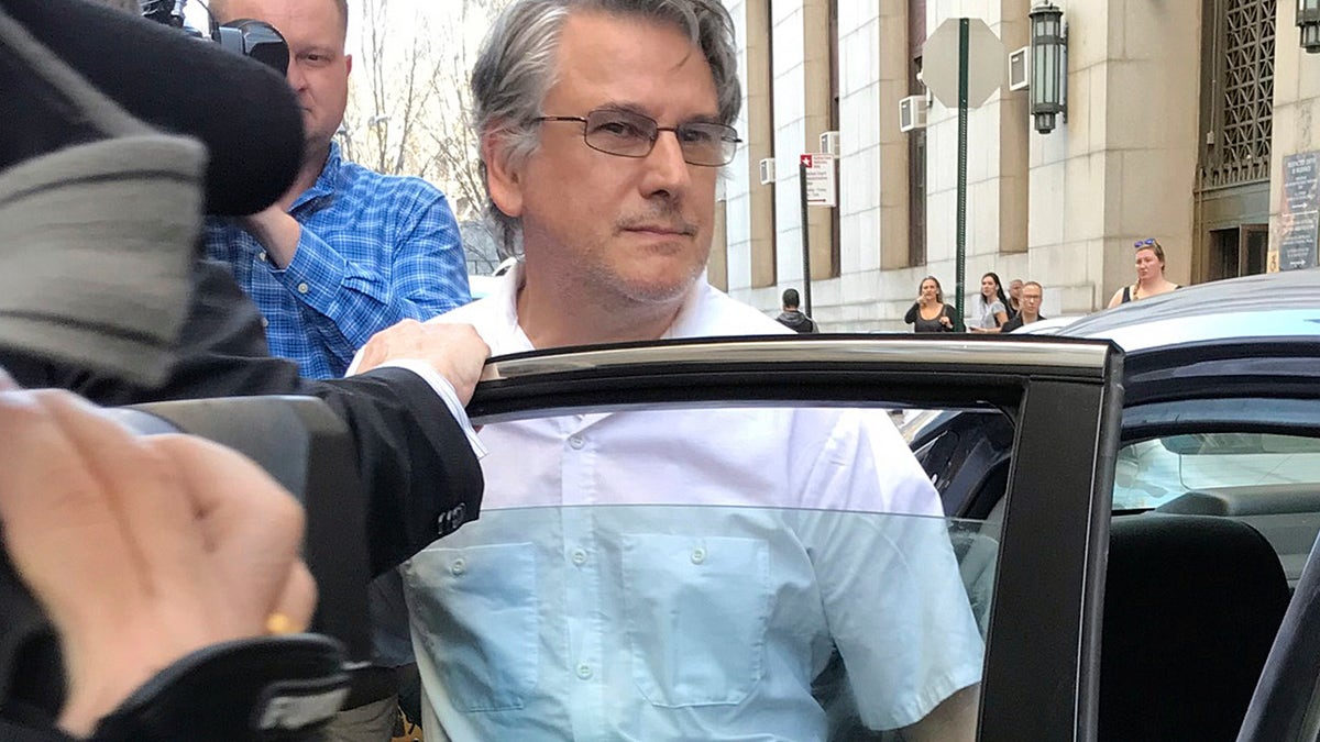 Dr. Ricardo Cruciani exiting a vehicle