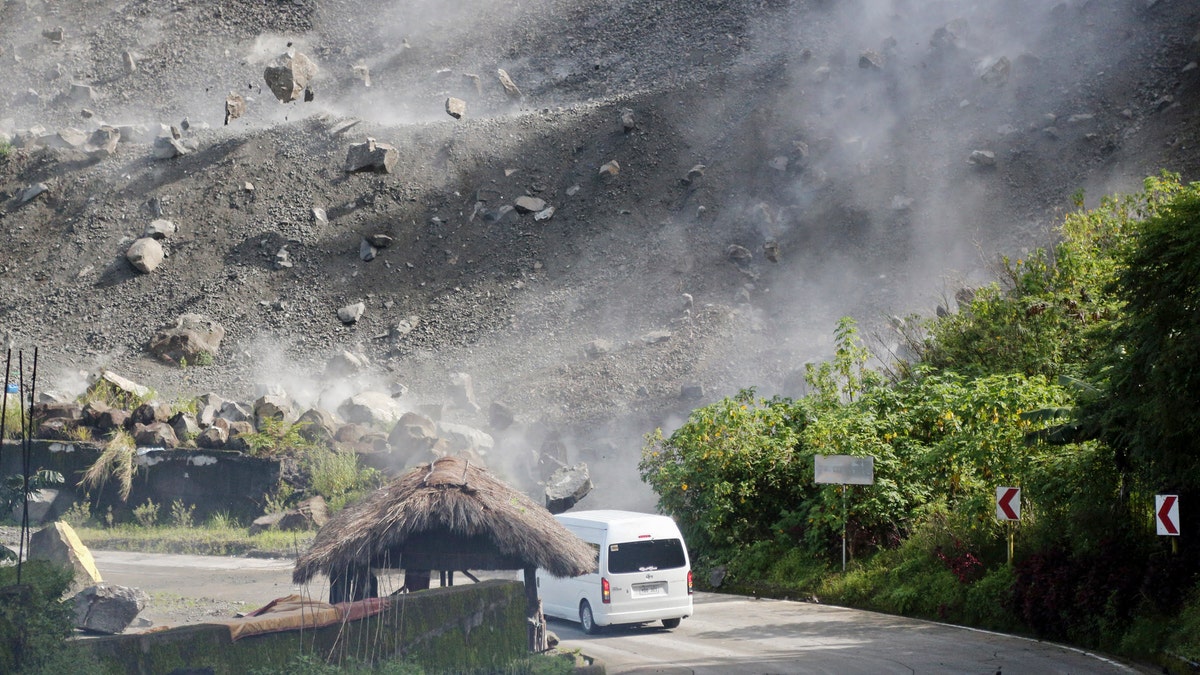 A car is hit by falling rocks during an earthquake in the Philippines