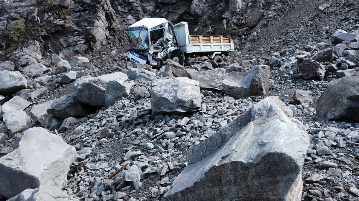 A picture of a truck that was crushed during an earthquake in the Philippines