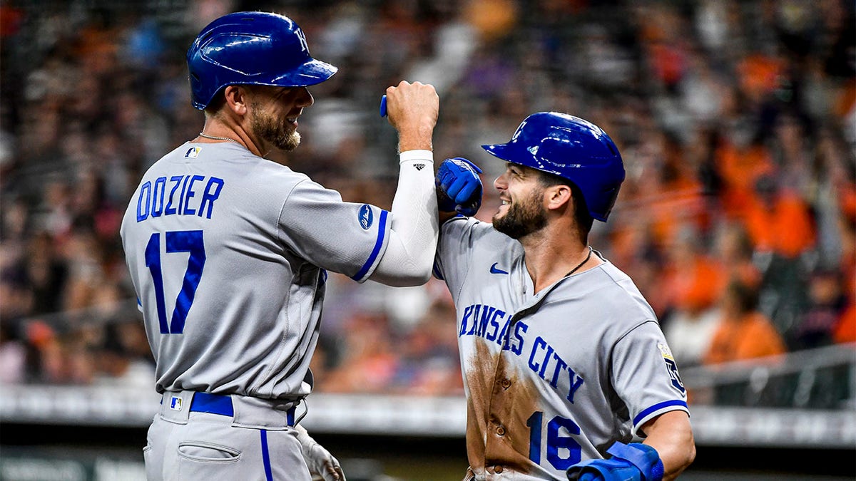 Hunter Dozier and Andrew Benintendi celebrate
