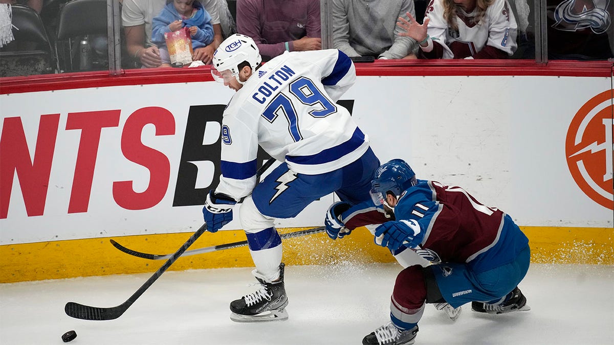 Andrew Cogliano pursues Ross Colton