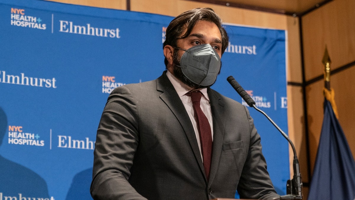 New York City health commissioner Ashwin Vashan appears in a suit