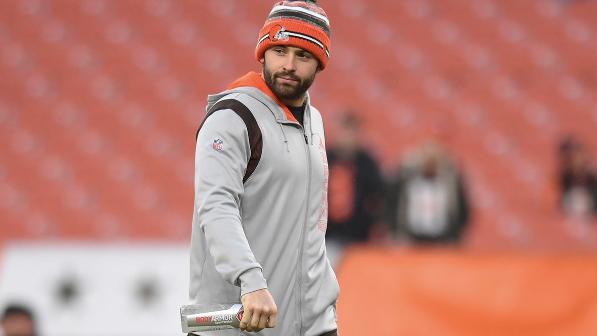 Baker Mayfield walks the sideline