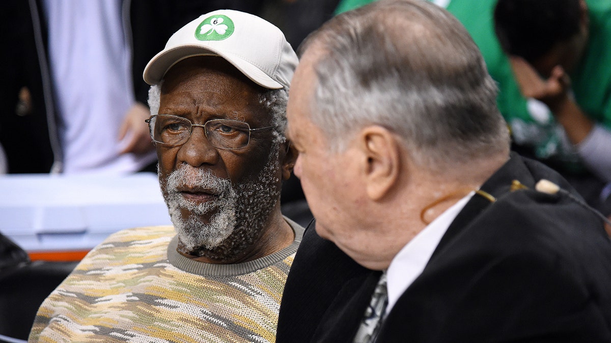 Bill Russell watches a game