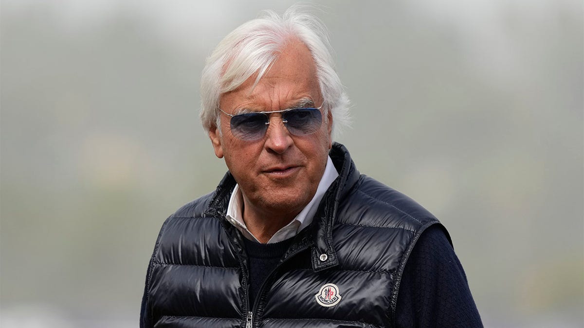 Bob Baffert looks on