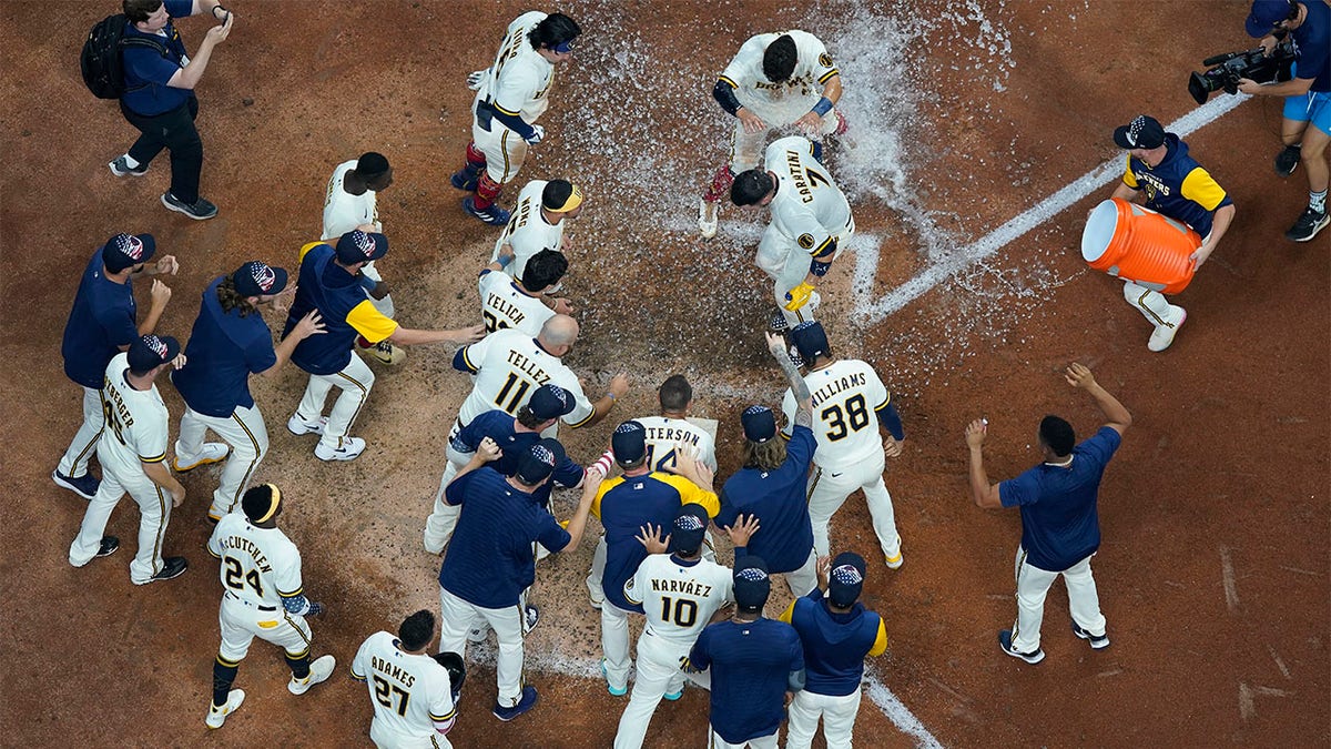 Brewers celebrate at home plate 