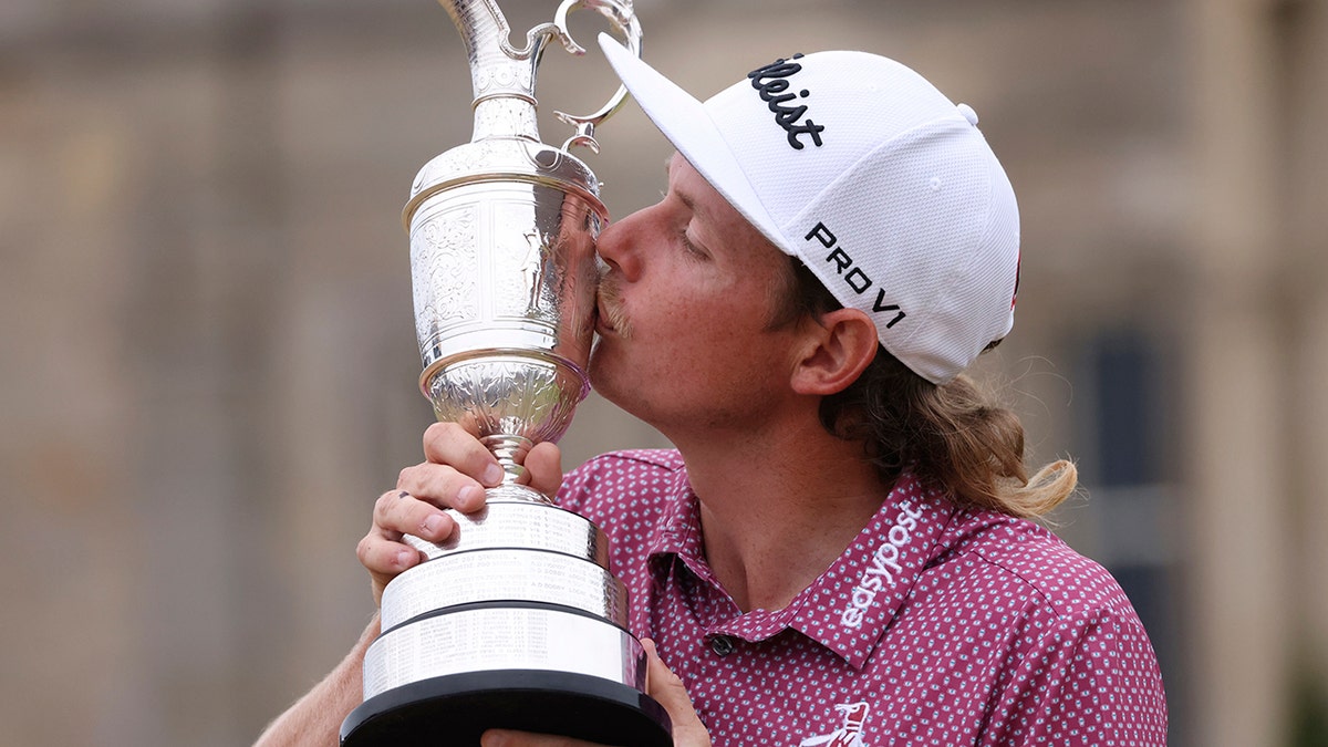 Cam Smith kisses the Claret Jug