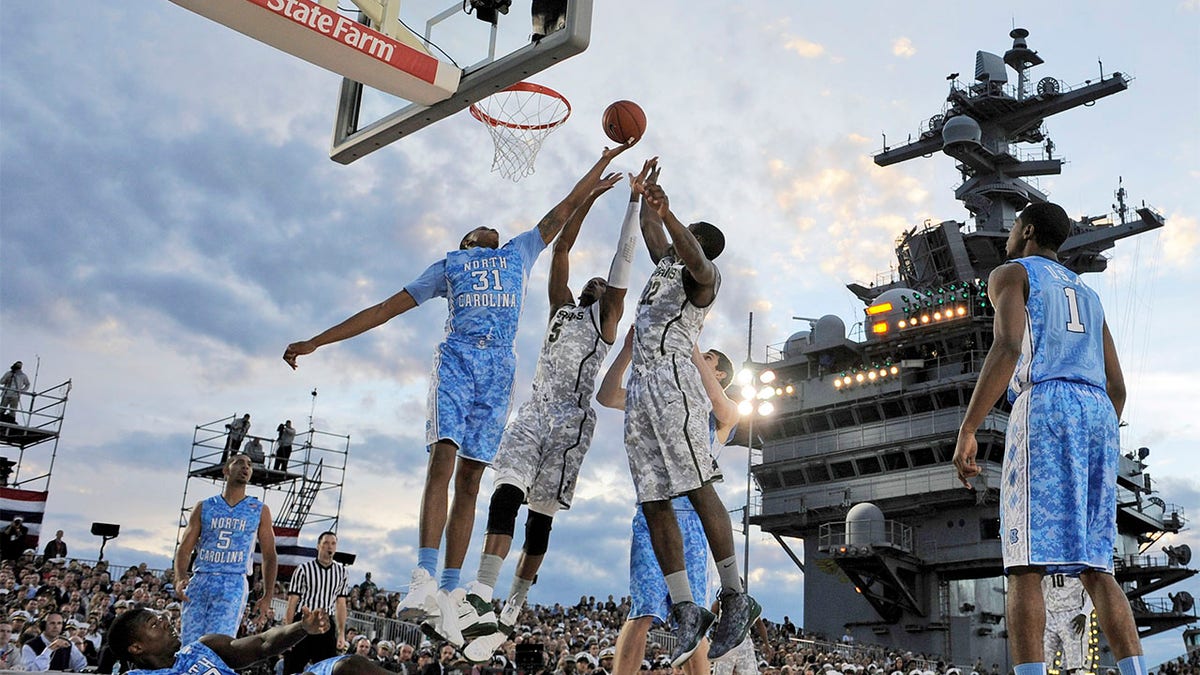 John Henson jumps for rebound during carrier court game