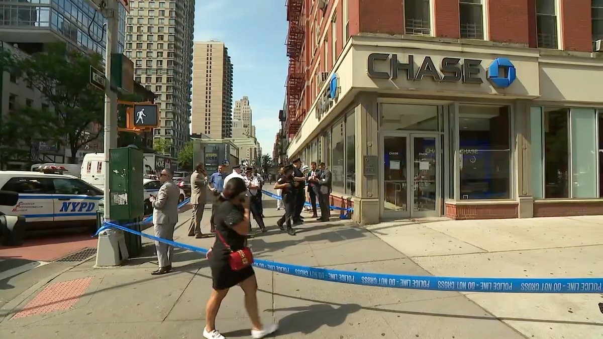 Police tape outside Chase bank on NYC street corner