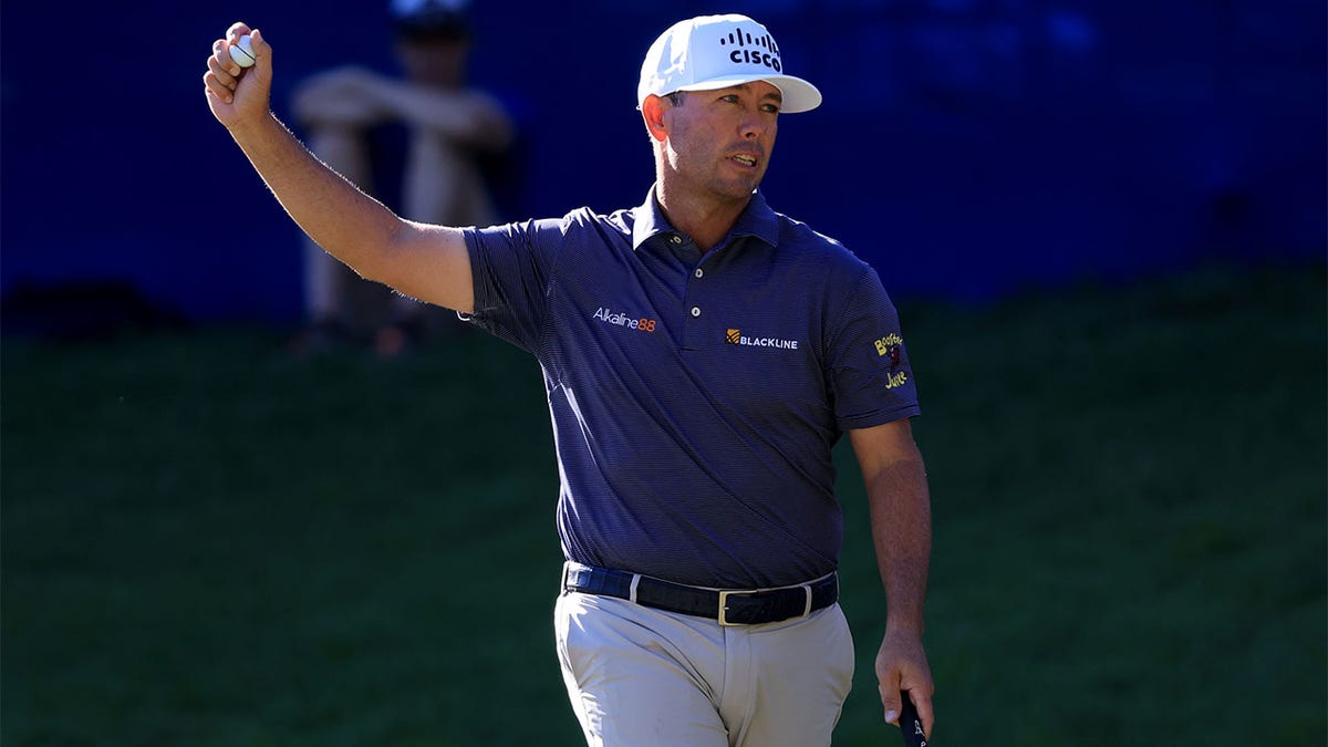 Chez Reavie reacts after putting to win