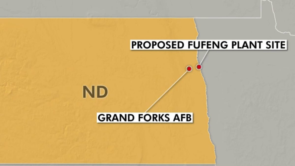 Graphic of North Dakota with two dots showing Grand Forks AFB and a proposed plant purchased by Chinese food producer.