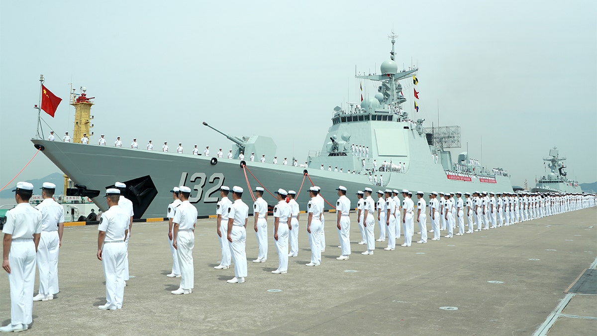 Chinese Navy destroyer Suzhou is seen in Zhejiang Province with sailors in white
