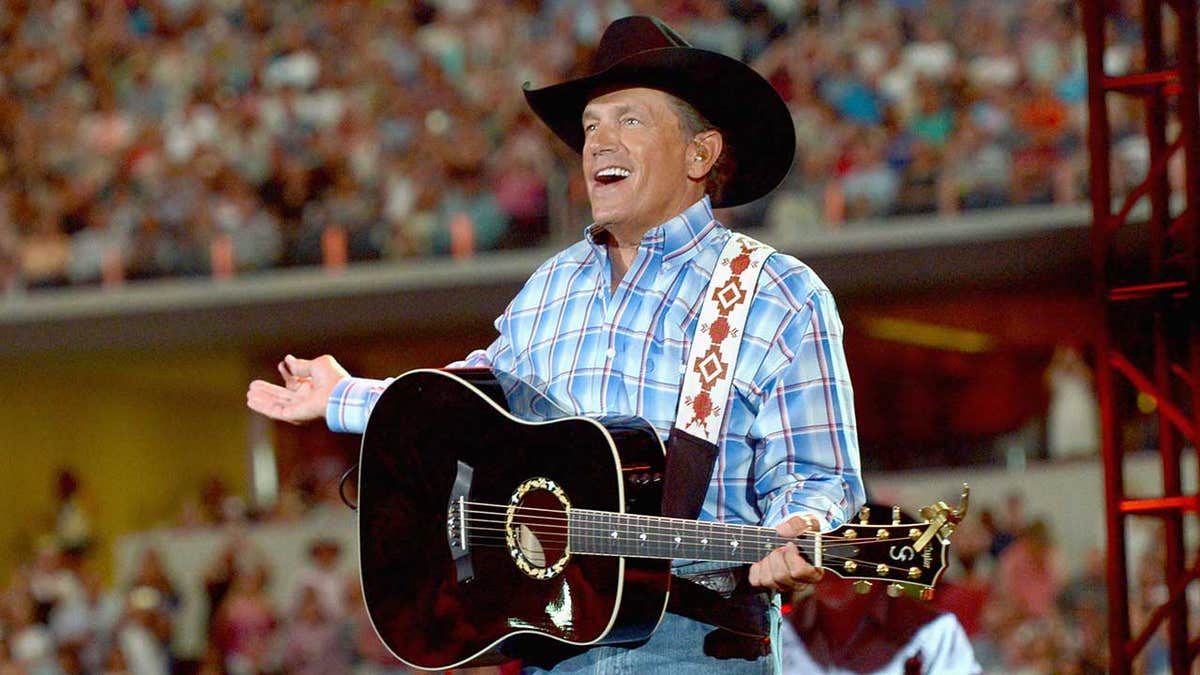 George Strait performs onstage at AT&T Stadium on June 7, 2014 in Arlington, Texas.