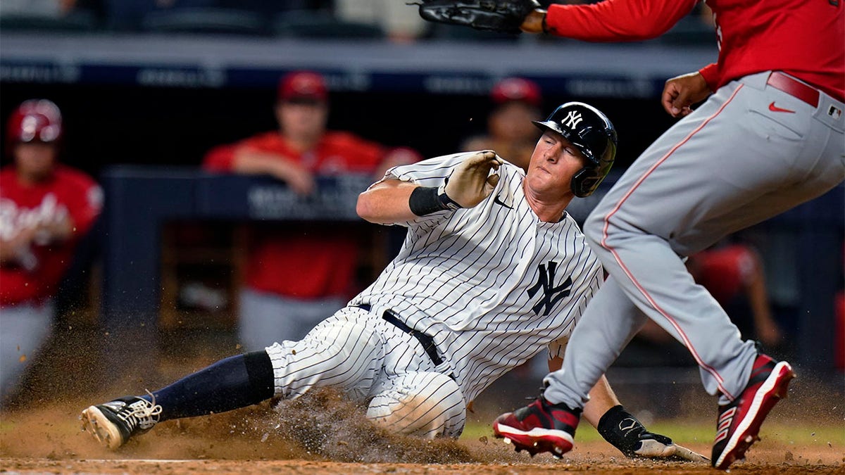 DJ LeMahieu slides home