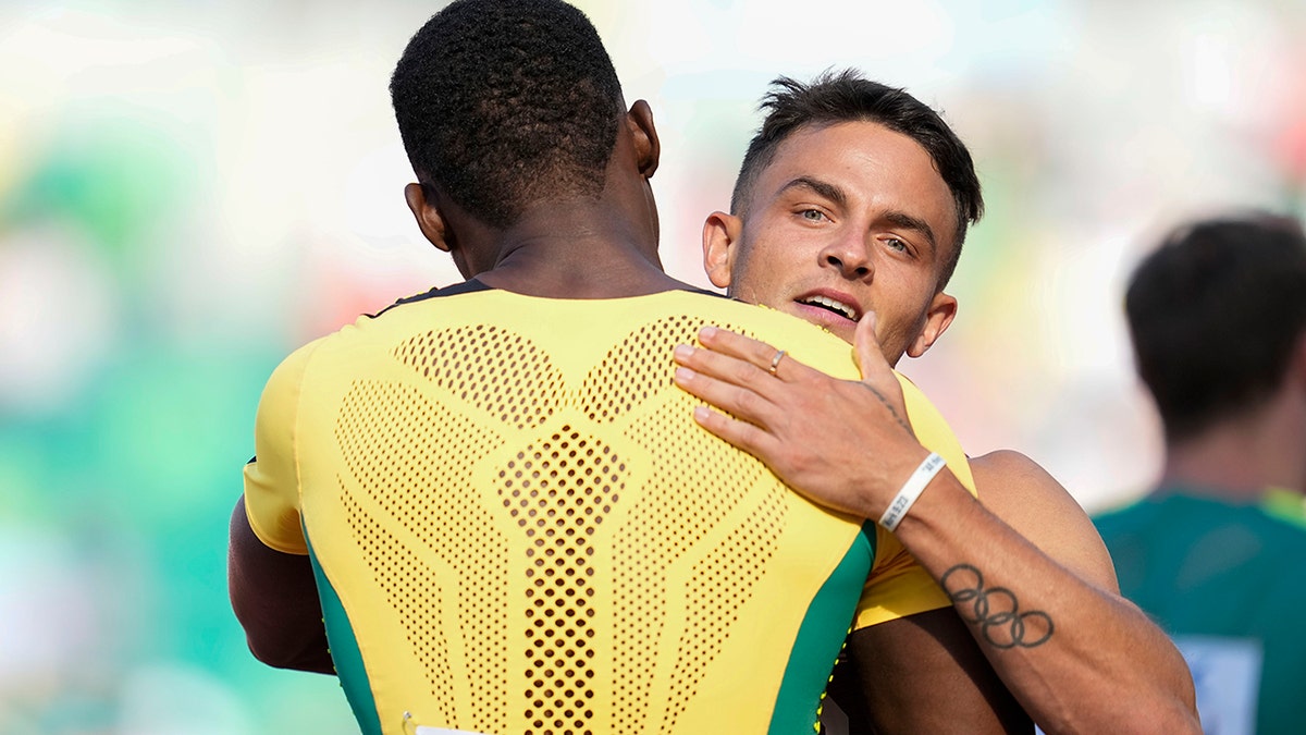 Devon Allen embraces Hansle Parchment