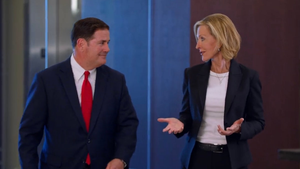 Arizona Gov. Doug Ducey and Karrin Taylor Robson