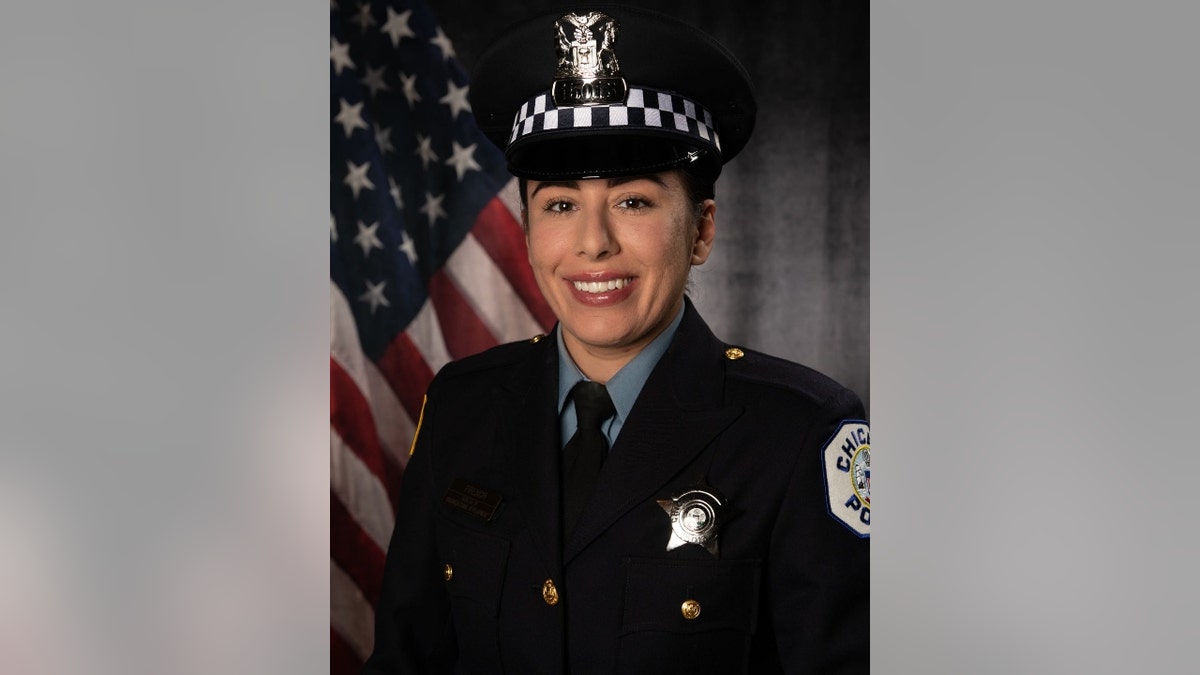 Chicago Police Officer Ella French in uniform in front of an American flag