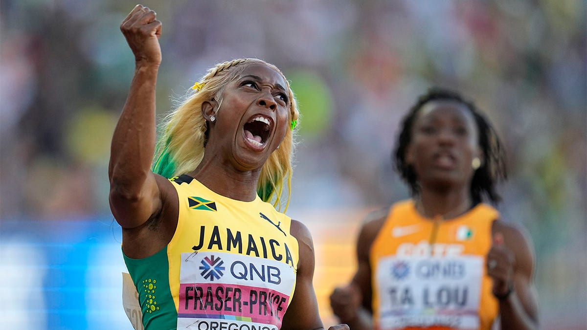Shelly-Ann Fraser-Pryce celebrates after winning