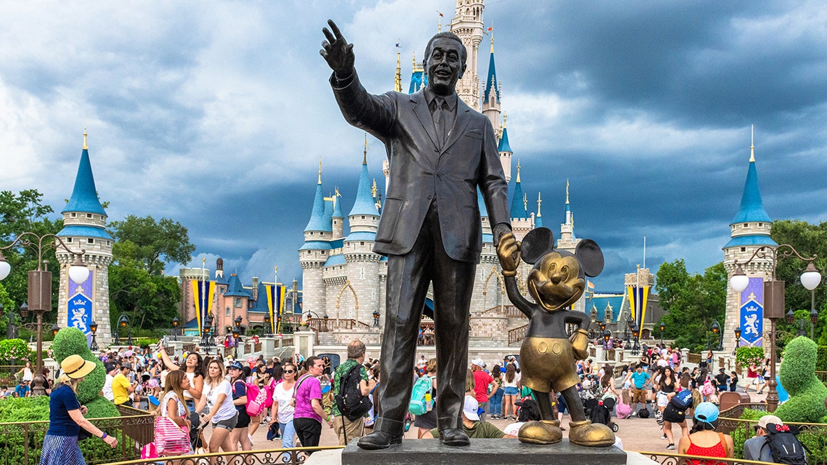 walt disney statue and mickey mouse