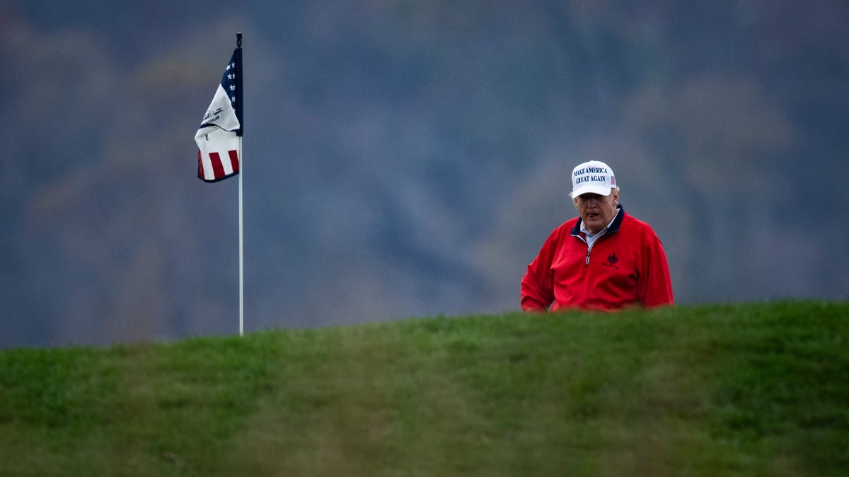President Donald Trump plays golf in November 2020