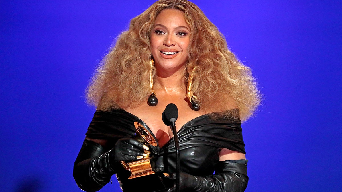 Beyoncé holding a Grammy 