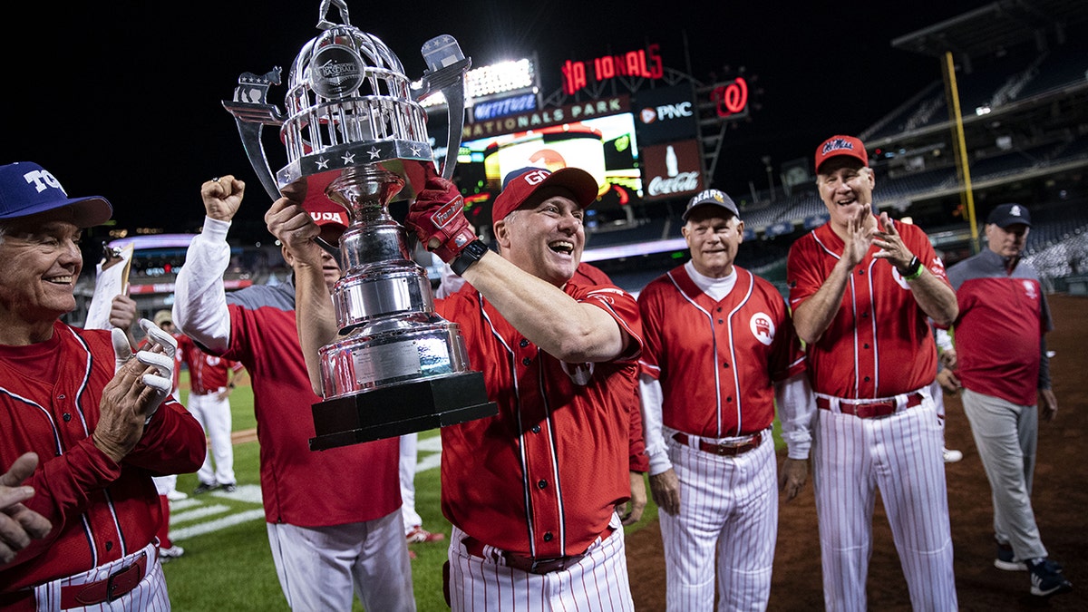 Steve Scalise holds trophy at 2021 congressional baseball game