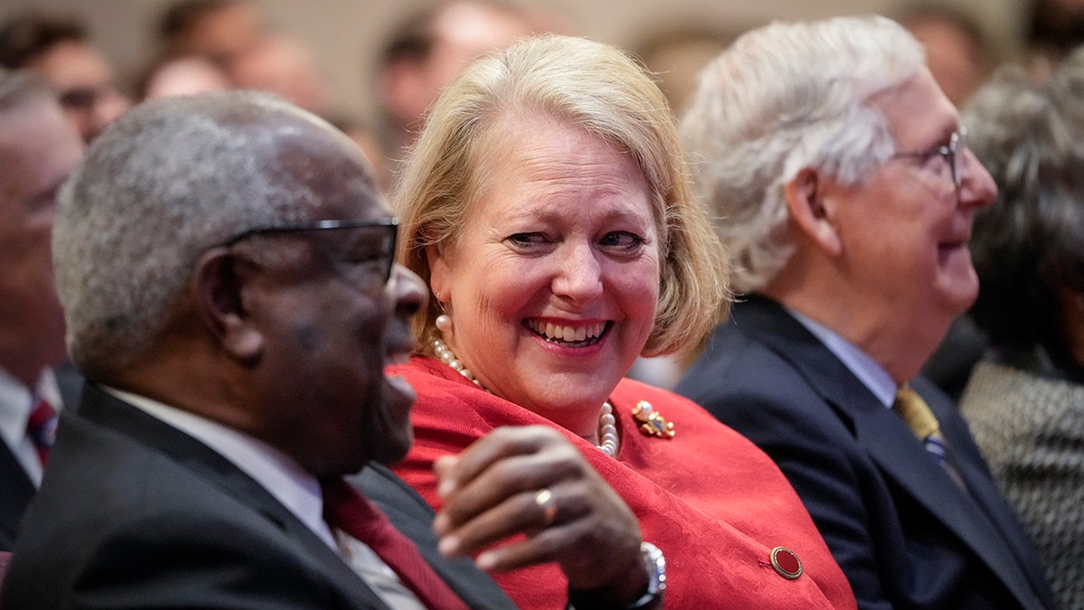 Clarence and Ginni Thomas laughing