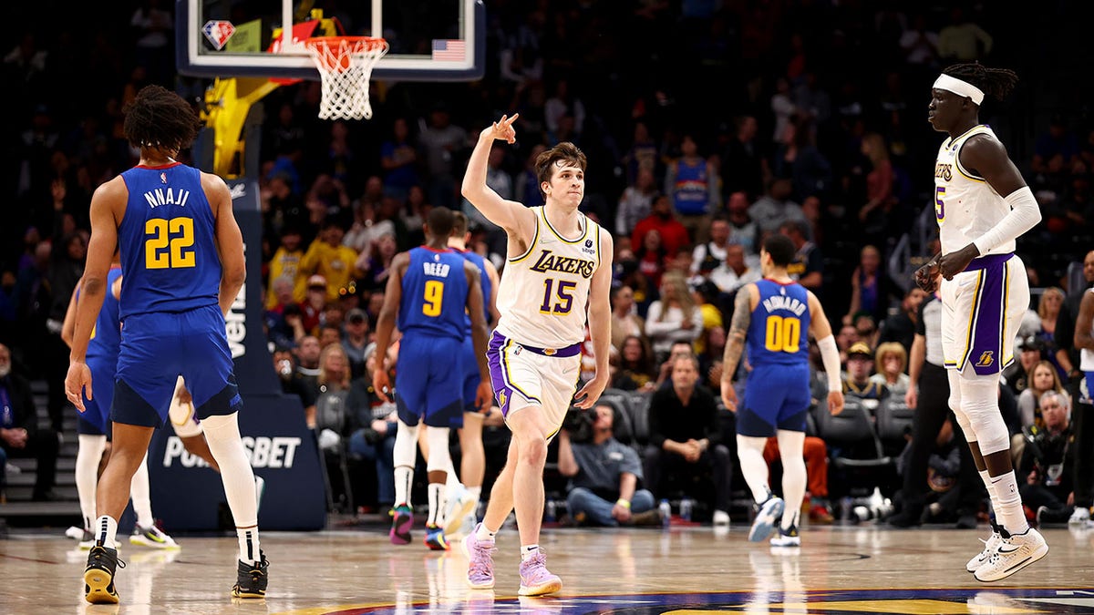 Austin Reaves celebrates after hitting a shot against the Denver Nuggets