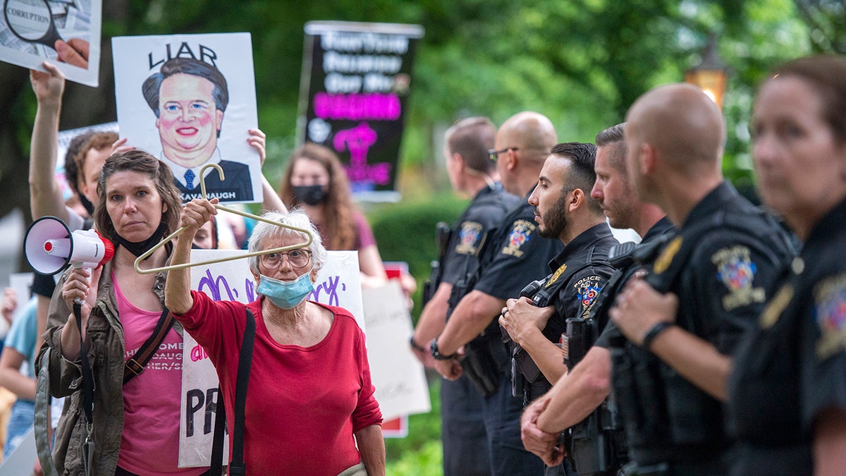 pro-choice protesters, police at kavanaugh's home
