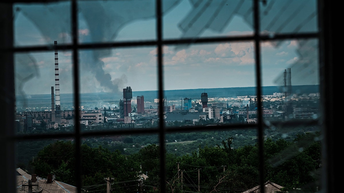 LYSYCHANSK, UKRAINE -- JUNE 13, 2022: A view of Severodonetsk, as seen from Lysychansk, Ukraine, Monday June 13, 2022. (Marcus Yam / Los Angeles Times via Getty Images)