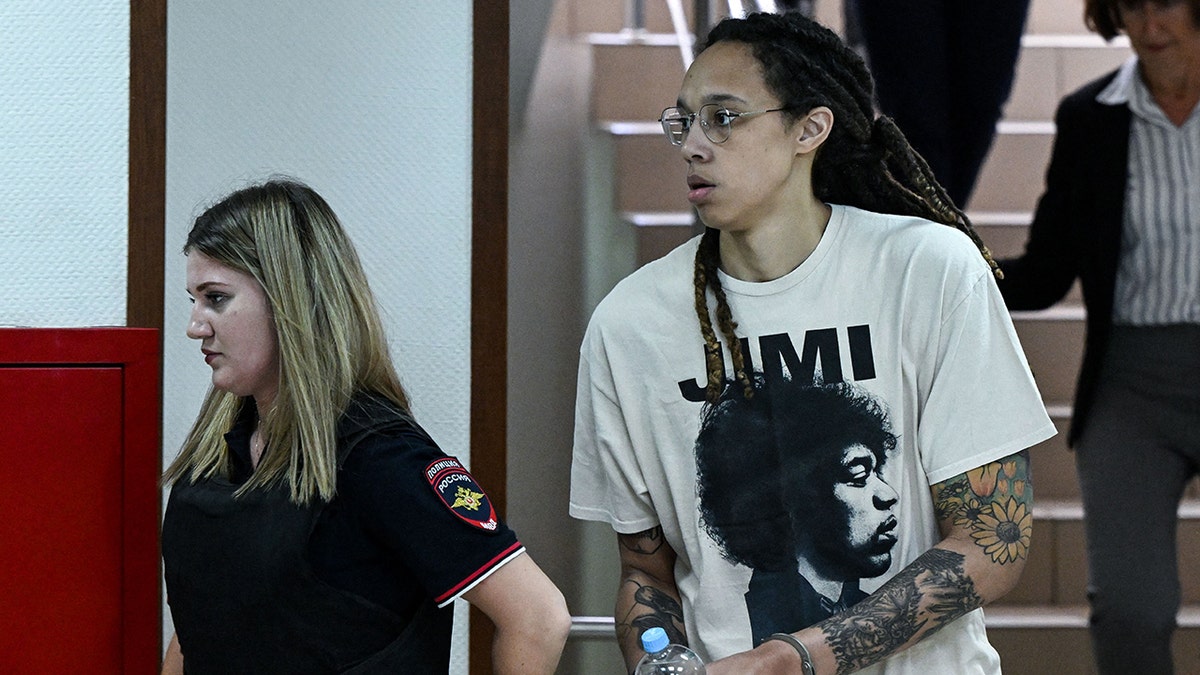 Brittney Griner being escorted into Russian court