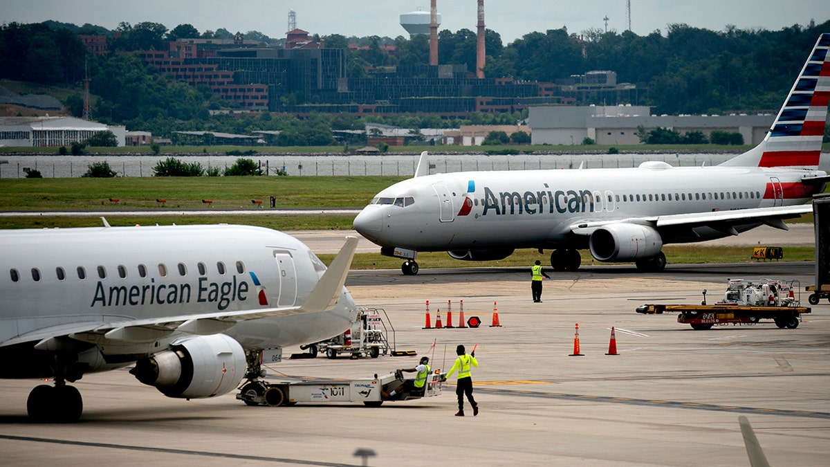 Two planes parked on the tarmac