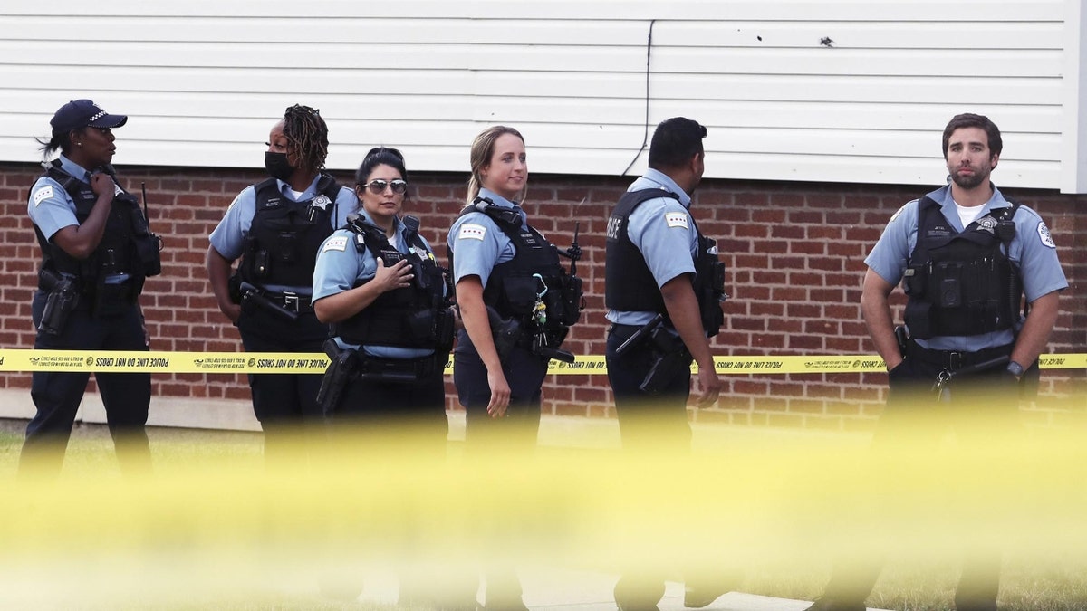 Chicago police secure a crime scene at 66th Street and Wolcott Avenue in Chicago where a person reportedly was shot in the head on July 1, 2022. (Terrence Antonio James/Chicago Tribune/Tribune News Service via Getty Images)