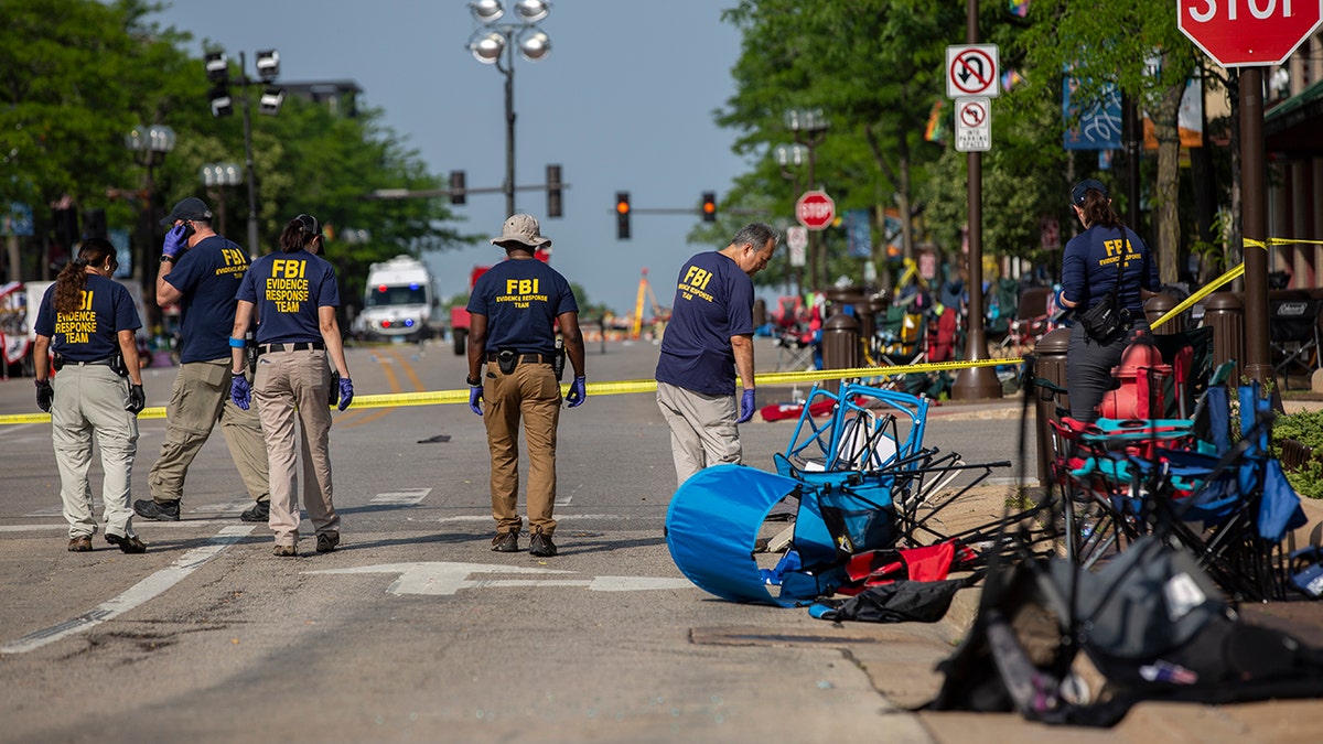 Authorities investigate after the Highland Park mass shooting