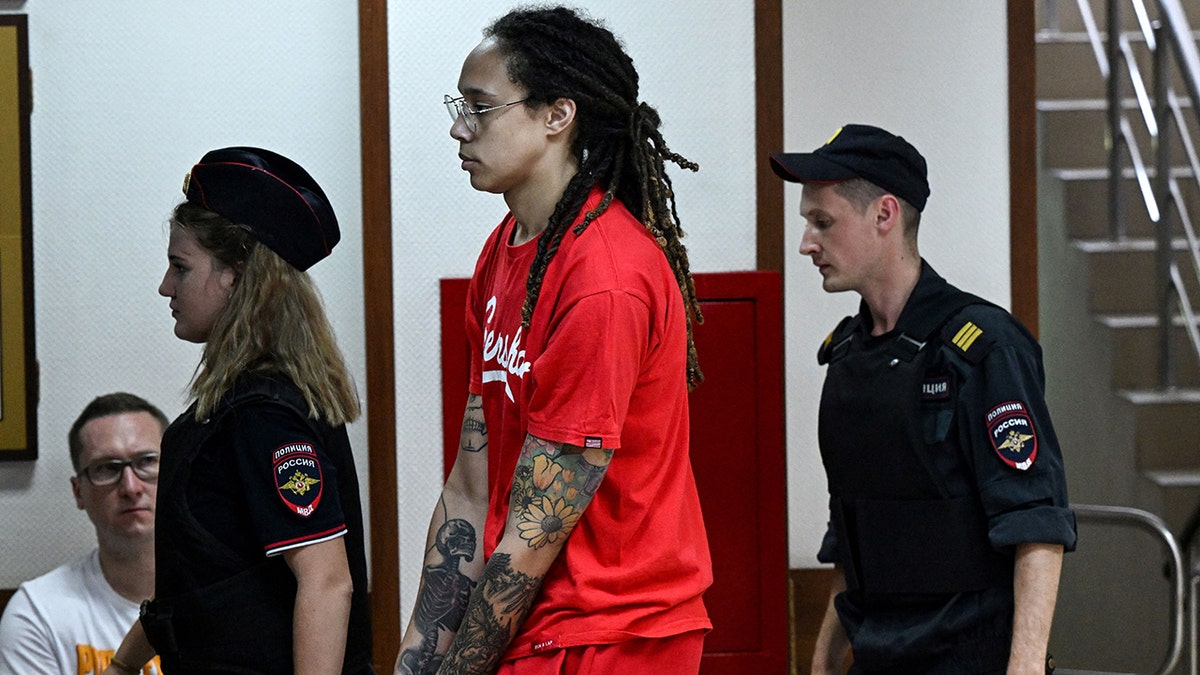 Brittney Griner is escorted into court