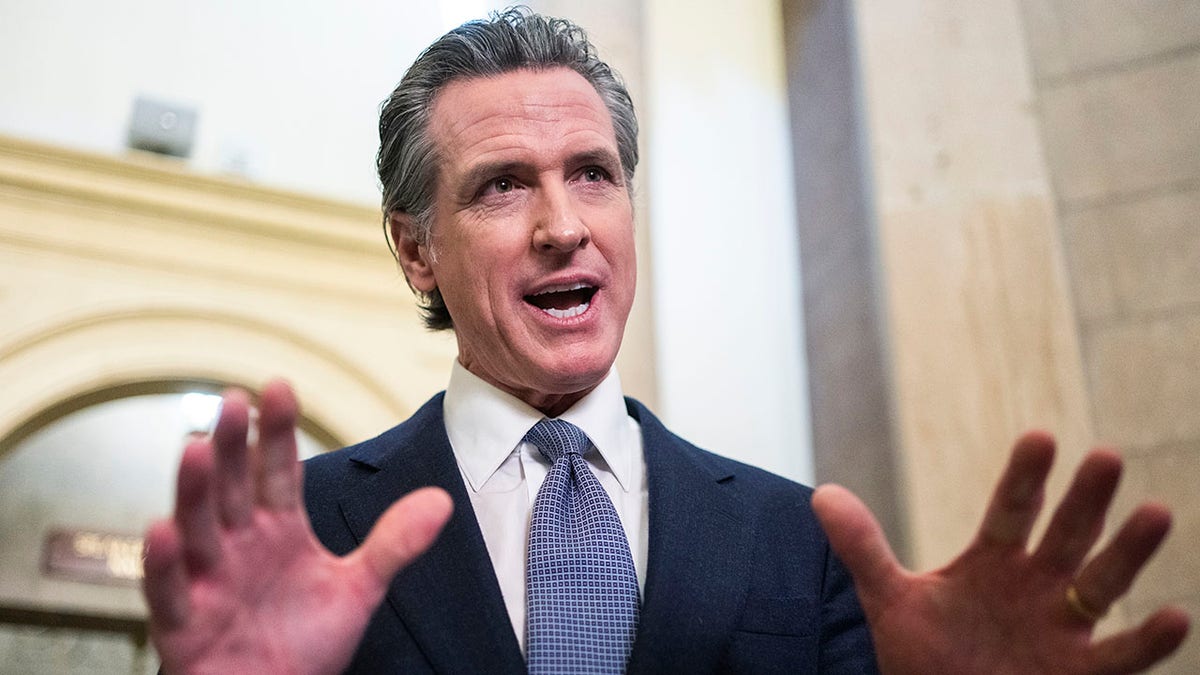 Democrat Gov. Gavin Newsom of California speaking while motioning with his hands