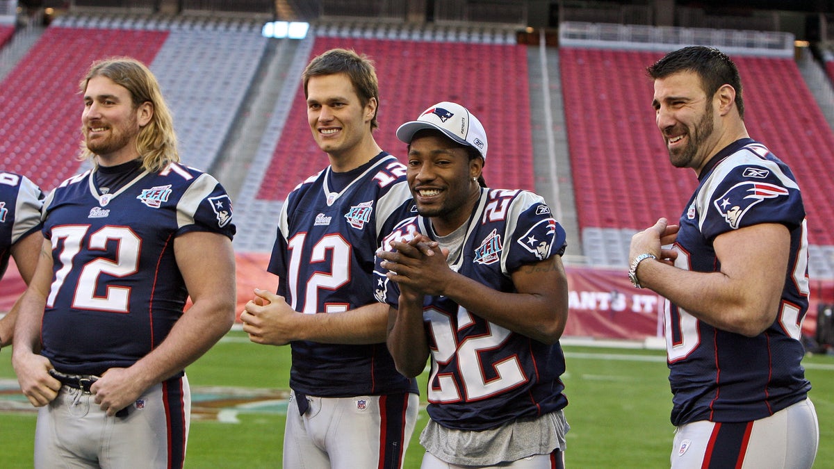 Asante Samuel, Tom Brady and other Patriots players at a media day