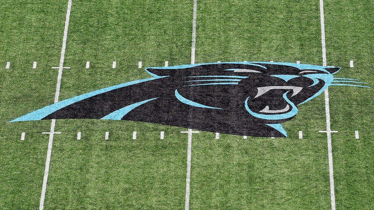 The Panthers logo on the field before a game against the NY Jets