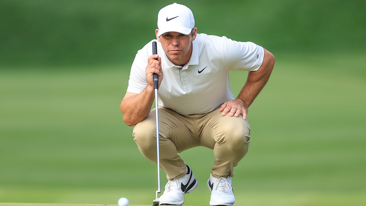 Paul Casey putts the ball
