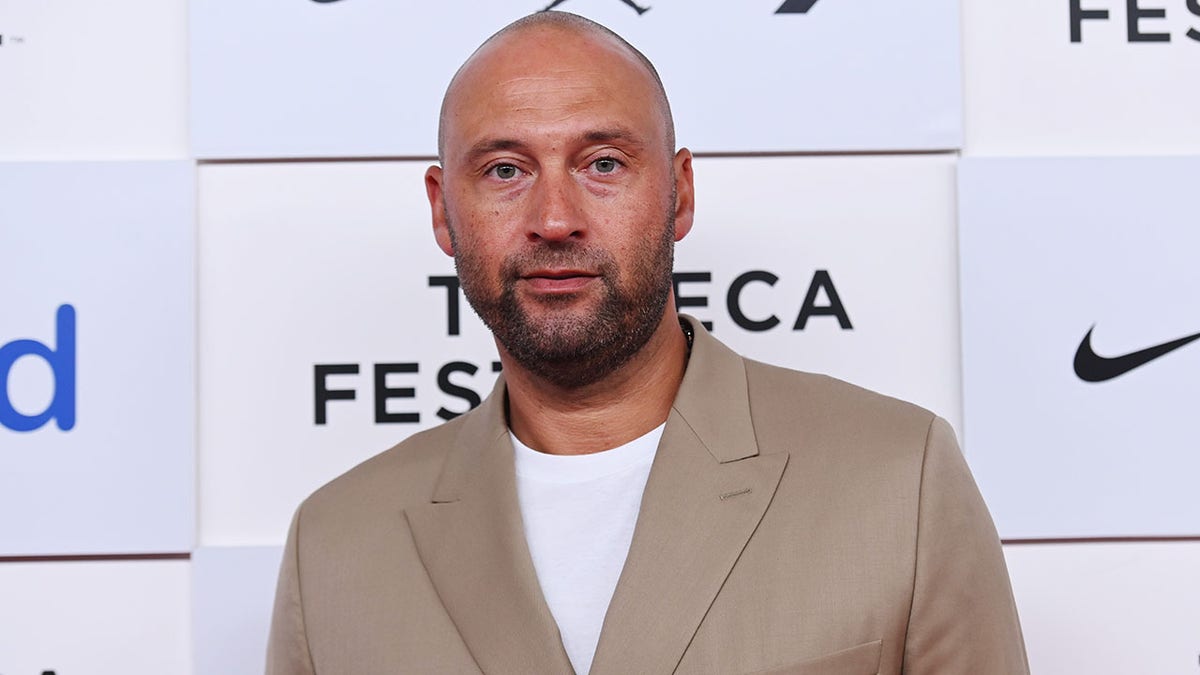 Derek Jeter poses at the premiere of "The Captain"