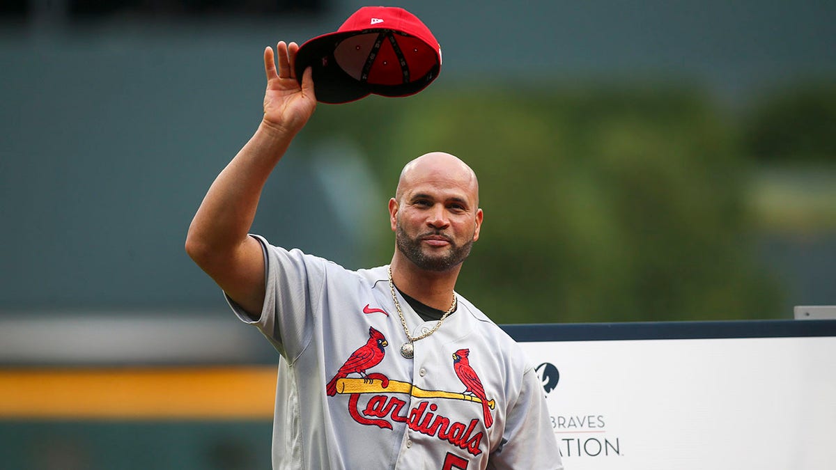 Albert Pujols thanks the fans after being honored at Truist Park